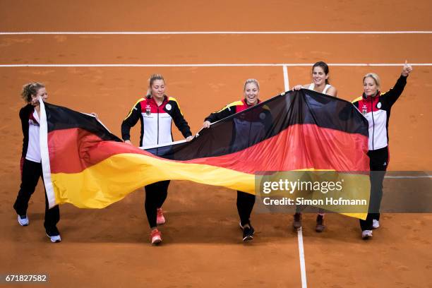 Laura Siegmund, Carina Witthoeft, Angelique Kerber, Julia Goerges and Barbara Rittner of Germany celebrate victory during the FedCup World Group...