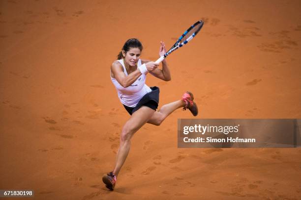 Julia Goerges of Germany returns the ball against Lesia Tsurenko of Ukraine during the FedCup World Group Play-Off match between Germany and Ukraine...