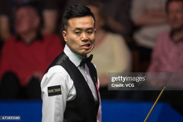 Marco Fu of Chinese Hong Kong reacts during his second round match against Neil Robertson of Australia on day nine of Betfred World Championship 2017...