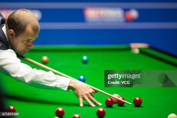 Graeme Dott of Scotland plays a shot during his second round match against Barry Hawkins of England on day nine of Betfred World Championship 2017 at...