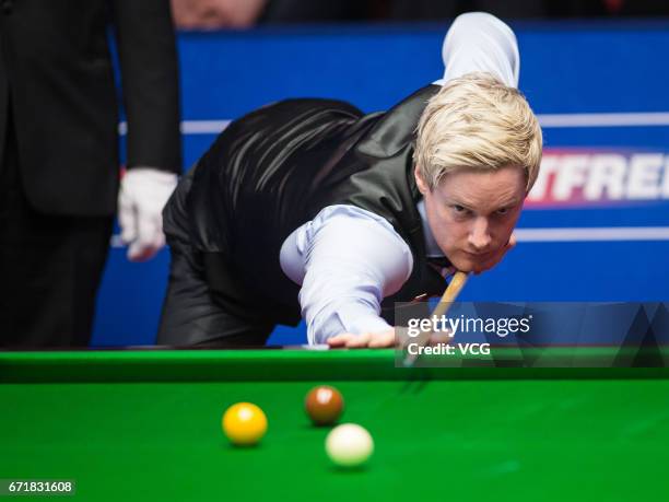 Neil Robertson of Australia plays a shot during his second round match against Marco Fu of Chinese Hong Kong on day nine of Betfred World...