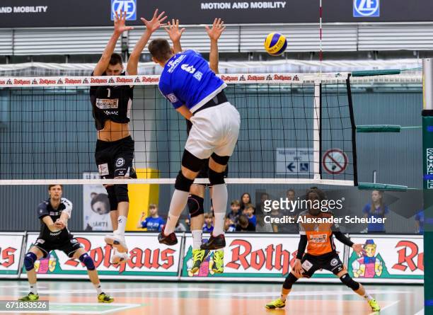 Michal Finger of Friedrichshafen in action against the block of Aleksandar Okolic of Berlin during the Volleyball final playoffs match 1 between VFB...