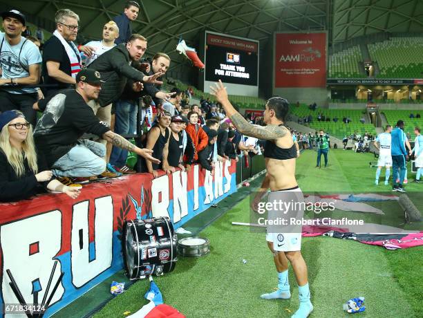 Tim Cahill of Melbourne City throws his boots into the crowd after City were defeated by Perth Glory during the A-League Elimination Final match...