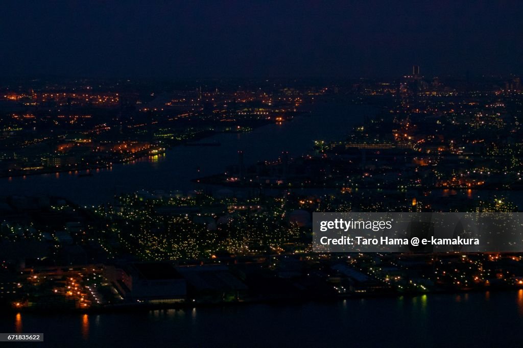 Keihin factory area in Kawasaki and Yokohama city night aerial view from airplane