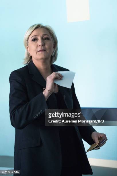 Marine Le Pen, National Front Party Leader and candidate for the 2017 French Presidential Election votes in the first round of the election at the...