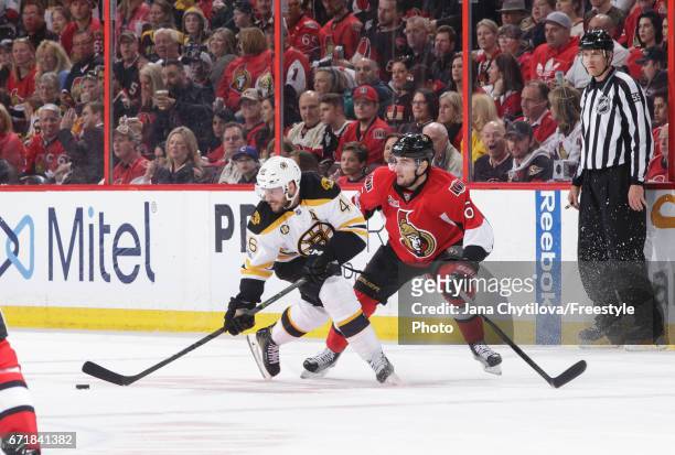 Chris Wideman of the Ottawa Senators defends against David Krejci of the Boston Bruins in Game Five of the Eastern Conference First Round during the...