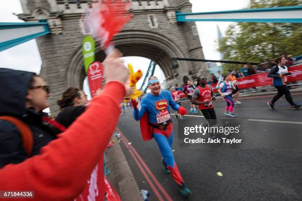 Runners cross the halfway point of the 2017 Virgin Money London Marathon on April 23, 2017 in London, England. Around 40,000 runners take part in the...