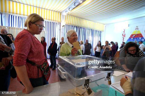 French citizens in Tunisia cast their votes at Gustave Flaubert School for the first round of the presidential election in France to choose two...