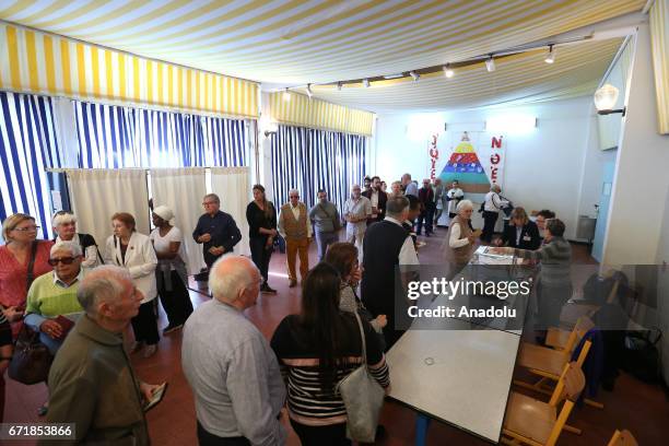 French citizens in Tunisia cast their votes at Gustave Flaubert School for the first round of the presidential election in France to choose two...