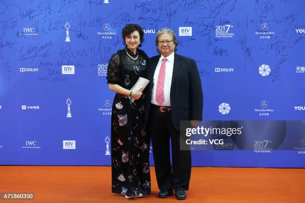 Actor, film director and producer Sammo Hung poses with his wife Joyce Mina Godenzi at red carpet during the closing ceremony of 2017 Beijing...