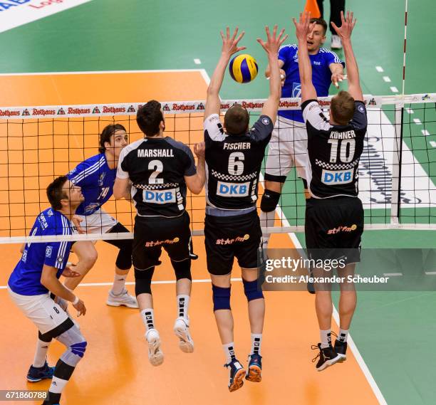 Steven Marshall of Berlin, Felix Fischer of Berlin and Sebastian Kuehner of Berlin block a ball during the Volleyball final playoffs match 1 between...