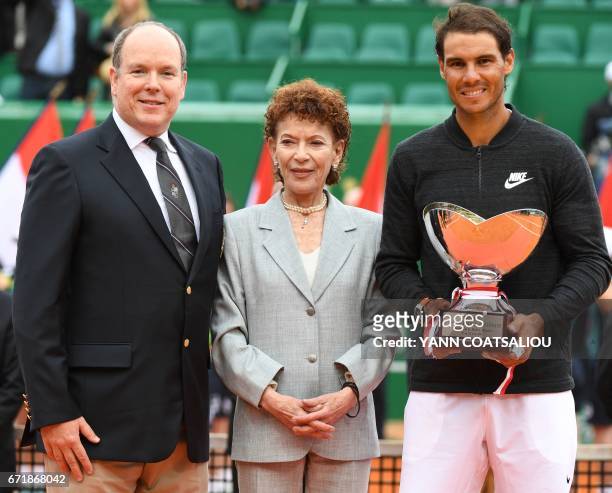 Spain's Rafael Nadal holds his trophy, next to Prince Albert II of Monaco and Elisabeth-Anne de Massy , during the awarding ceremony following the...