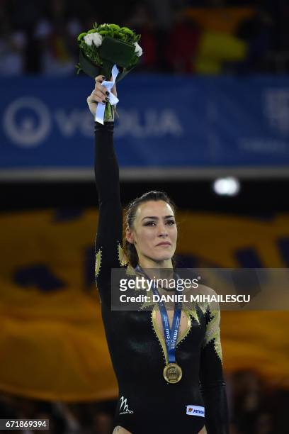 Gold medal winner Catalina Ponor of Romania poses on the podium during medals ceremony for balance beam of apparatus final for the European Artistic...