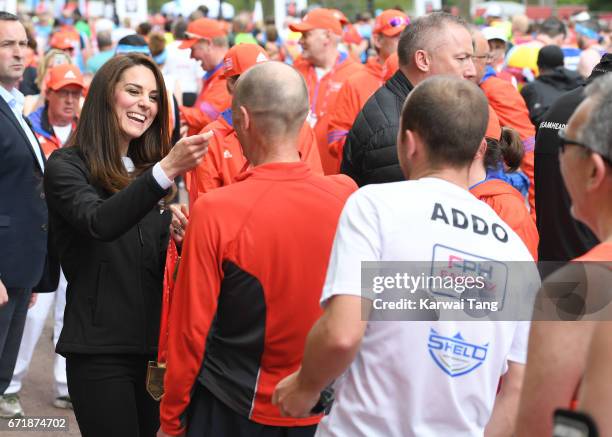 Catherine, Duchess of Cambridge gives out medals to the finishers of the 2017 Virgin Money London Marathon on April 23, 2017 in London, England.