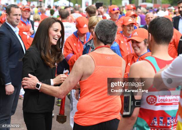 Catherine, Duchess of Cambridge gives out medals to the finishers of the 2017 Virgin Money London Marathon on April 23, 2017 in London, England.