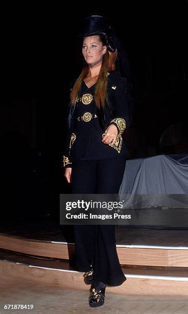 Christy Turlington walk the runway at the Rock N' Rule Benefit Gala for AmFar hosted by Versace circa 1992 in New York City.