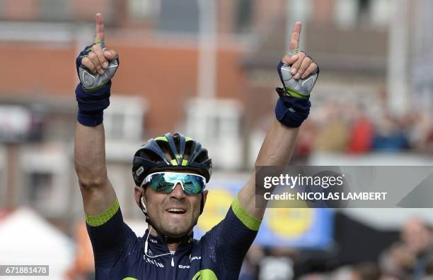 Spanish Alejandro Valverde of Movistar Team celebrates as he crosses the finish line to win the 102nd edition of the Liege-Bastogne-Liege one day...