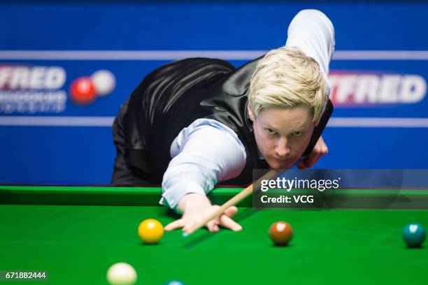 Neil Robertson of Australia plays a shot during his second round match against Marco Fu of Chinese Hong Kong on day nine of Betfred World...