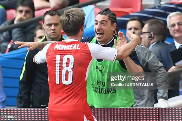 Arsenal's Spanish defender Nacho Monreal celebrates scoring their first goal with Arsenal's Spanish defender Hector Bellerin during the FA Cup...