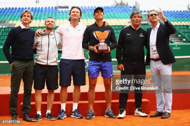 Team Nadal L-R Agent Carlos Costa, physio Rafael Maymo,coach Carlos Moya,Rafael Nadal with his 10th winners trophy, coach Toni Nadal and PR Benito...