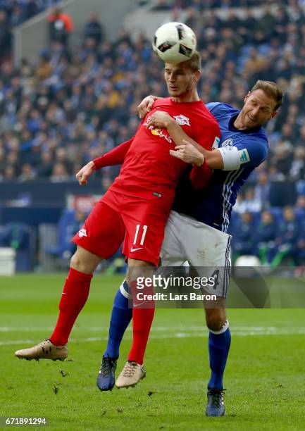 Timo Werner of Leipzig heads his teams first goal against Benedikt Hoewedes of Schalke during the Bundesliga match between FC Schalke 04 and RB...