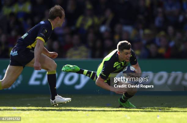 Garry Ringrose of Leinster breaks clear of Nick Abendanon to score a try during the European Rugby Champions Cup semi final match between ASM...