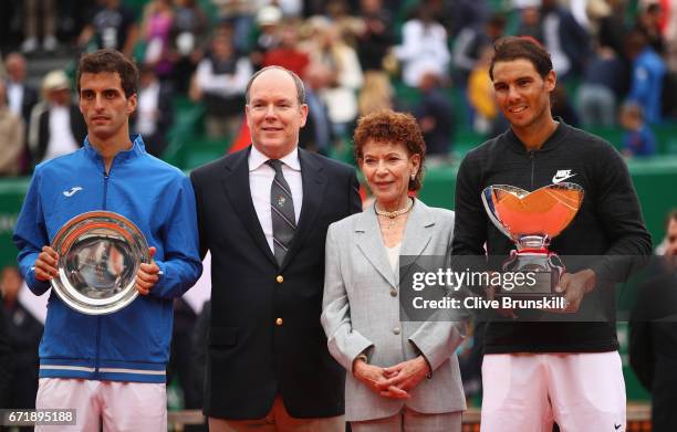 Rafael Nadal of Spain holds his winners trophy alongside Albert Ramos-Vinolas of Spain, Prince Albert ll of Monaco and Elisabeth Anne de Massy...