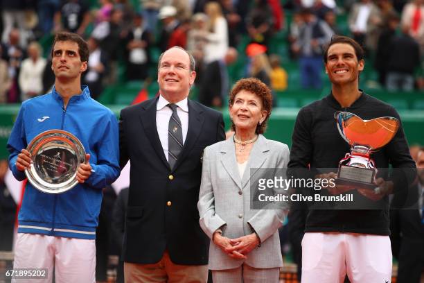 Rafael Nadal of Spain holds his winners trophy alongside Albert Ramos-Vinolas of Spain, Prince Albert ll of Monaco and Elisabeth Anne de Massy...
