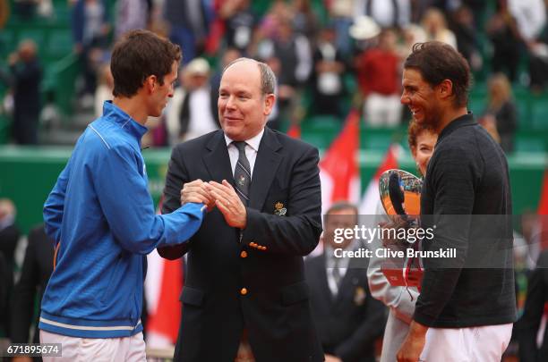 Albert Ramos-Vinolas of Spain talks to Prince Albert ll of Monaco after his straight set defeat by Rafael Nadal of Spain in the final on day eight of...