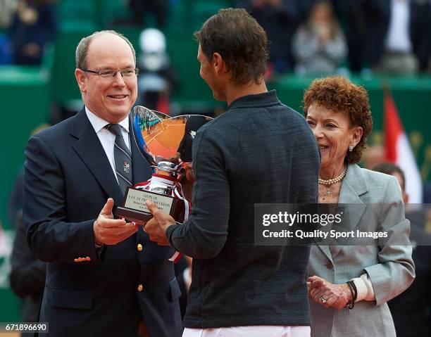 Rafael Nadal of Spain receives the winners trophy from Prince Albert II of Monaco after defeating Albert Ramos-Vinolas of Spain in the final during...