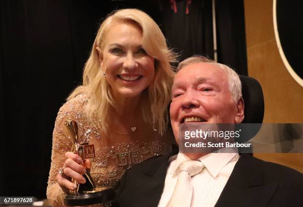 Kerri-Anne Kennerley and her husband John Kennerley pose with the Hall Of Fame Logie Award during the 59th Annual Logie Awards at Crown Palladium on...
