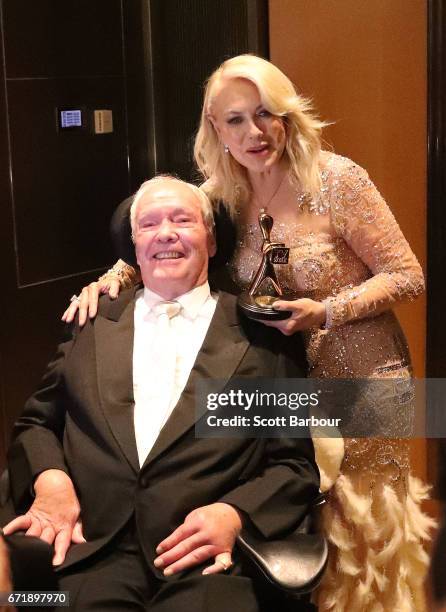 Kerri-Anne Kennerley and her husband John Kennerley pose with the Hall Of Fame Logie Award during the 59th Annual Logie Awards at Crown Palladium on...