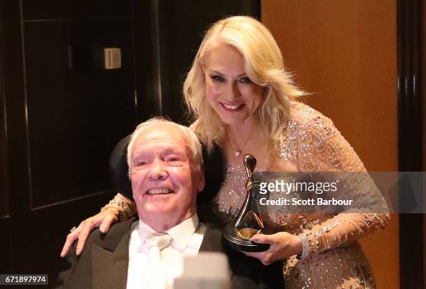 Kerri-Anne Kennerley and her husband John Kennerley pose with the Hall Of Fame Logie Award during the 59th Annual Logie Awards at Crown Palladium on...