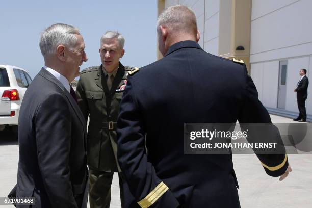 Defense Secretary James Mattis is greeted by US Marine Corps General Thomas Waldhauser as he arrives at Camp Lemonnier in Ambouli, Djibouti, on April...
