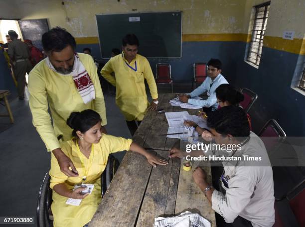 Swaraj India Party Chief Yogender Yadav with his party candidate arrives to cast the vote, during the MCD elections 2017, in East Delhi polling...