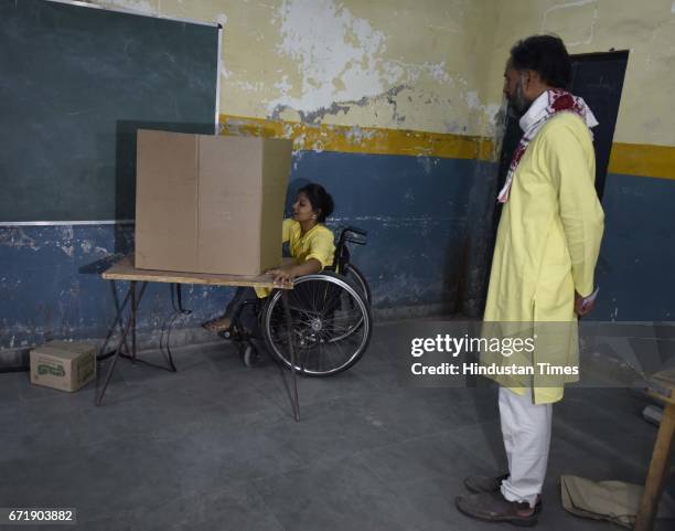 Swaraj India Party Chief Yogender Yadav with his party candidate arrives to cast the vote, during the MCD elections 2017, in East Delhi polling...