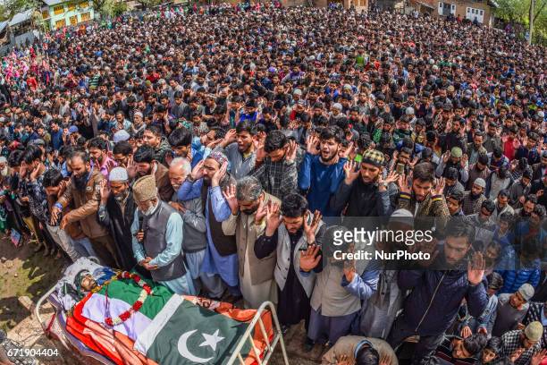 Kashmiri Muslims offer the funeral prayers in front the body of Younis Maqbool Ganie, a pro Kashmir rebel killed in a gun battle with Indian...