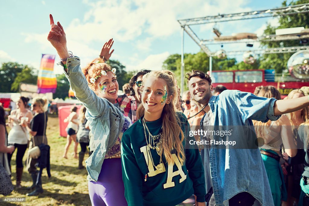 Group of friends having fun at a music festival