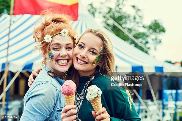 group of friends having fun at a music festival - entertainment tent stockfoto's en -beelden