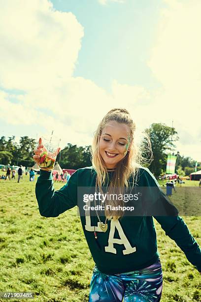 portrait of woman having fun at a music festival - music festival grass stock pictures, royalty-free photos & images