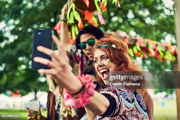 group of friends having fun at a music festival - calling festival stock pictures, royalty-free photos & images