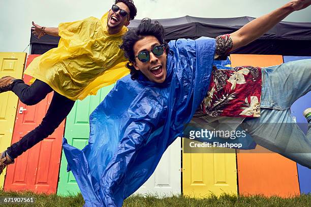 group of friends having fun at a music festival - youth culture stock pictures, royalty-free photos & images