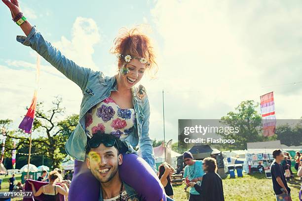 group of friends having fun at a music festival - festival stockfoto's en -beelden