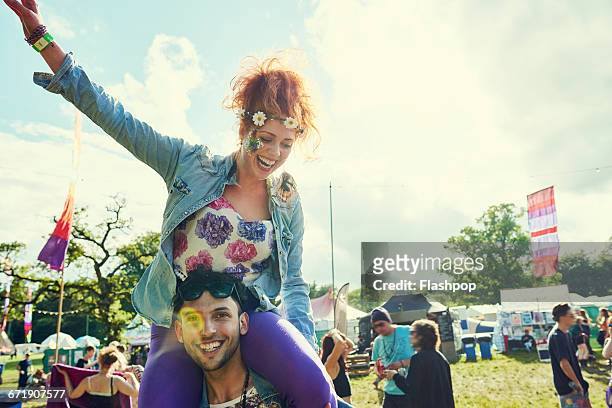 group of friends having fun at a music festival - music festival stock pictures, royalty-free photos & images
