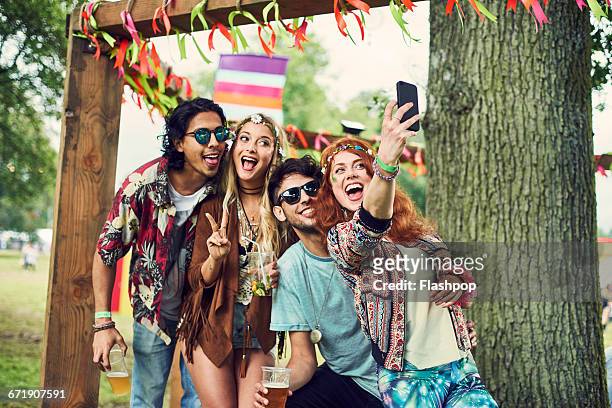 group of friends having fun at a music festival - festival selfie stock pictures, royalty-free photos & images