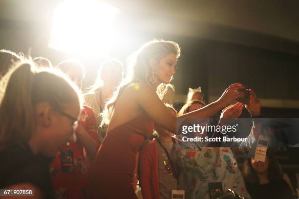 Delta Goodrem takes a selfie with a fan in the crowd as she arrives at the 59th Annual Logie Awards at Crown Palladium on April 23, 2017 in...