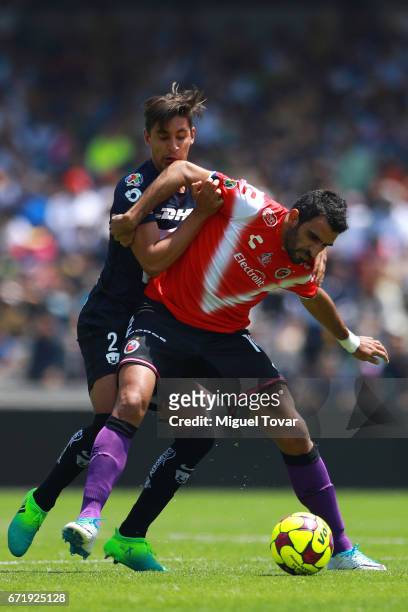 Jose Carlos Van Rankin of Pumas fights for the ball with Cristian Pellerano of Veracruz during the 15th round match between Pumas UNAM and Veracruz...