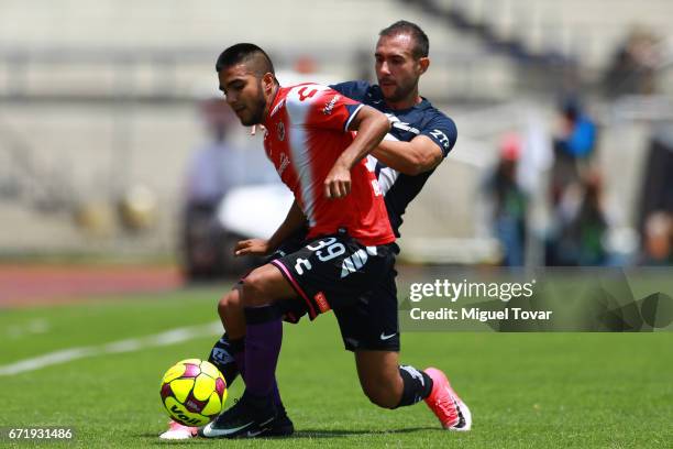 Alejandro Castro of Pumas fights for the ball with Leandro Velazquez of Veracruz during the 15th round match between Pumas UNAM and Veracruz as part...