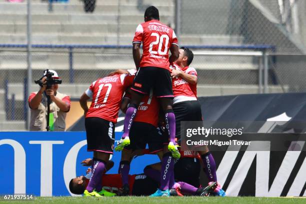 Leandro Velazquez of Veracruz celebrates with teammates after scoring the first goal of his team during the 15th round match between Pumas UNAM and...
