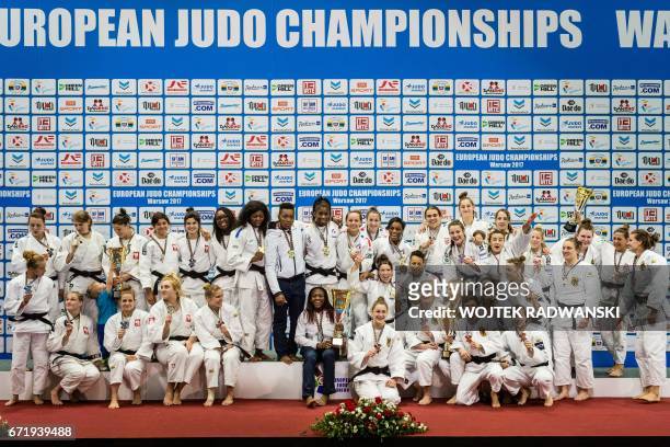 Polish , French , Croatian and German teams celebrate on the podium after the team competition of the European Judo Championship in Warsaw, Poland,...